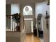 Bright foyer with high ceilings, hardwood floors, and a view of the front door at 911 Laurel Crest Dr, Woodstock, GA 30189