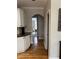 Hallway with hardwood floors and a view of another room through an archway at 911 Laurel Crest Dr, Woodstock, GA 30189
