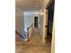 Upstairs hallway featuring carpeting and doors leading to bedrooms at 911 Laurel Crest Dr, Woodstock, GA 30189