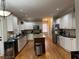 Spacious kitchen with an island, stainless steel appliances, and white cabinets at 911 Laurel Crest Dr, Woodstock, GA 30189