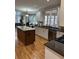 Bright kitchen with granite countertops, an island, and stainless steel appliances at 911 Laurel Crest Dr, Woodstock, GA 30189