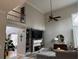 Inviting living room with vaulted ceilings, a fireplace, and natural light at 911 Laurel Crest Dr, Woodstock, GA 30189