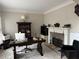 Well-lit office space with a fireplace, built-in shelving, and a spacious desk at 911 Laurel Crest Dr, Woodstock, GA 30189