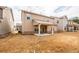 Expansive backyard with a covered patio, offering a serene outdoor space at 1187 Kingston Hill Dr, Loganville, GA 30052