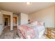 Spacious carpeted bedroom with neutral color scheme, lots of light, and a view into the ensuite bathroom at 1187 Kingston Hill Dr, Loganville, GA 30052