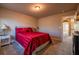 Bedroom featuring carpeted floors, neutral walls, and a small window providing natural light at 1187 Kingston Hill Dr, Loganville, GA 30052