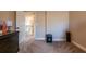 Bedroom with carpet and neutral walls, with a view to a door leading to the stairway at 1187 Kingston Hill Dr, Loganville, GA 30052