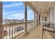 Covered front balcony with brick columns and wood floor at 581 Brashy St, Woodstock, GA 30188