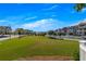 A lovely community space has a large grassy area nestled amongst beautiful neighborhood homes at 581 Brashy St, Woodstock, GA 30188