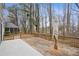 Backyard showcasing a large wooden deck with partial concrete patio, offering space for outdoor living and entertaining at 3815 Glen Laurel Ct, Cumming, GA 30040