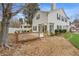 Well-maintained backyard with a spacious deck and sunroom attached to the home at 3815 Glen Laurel Ct, Cumming, GA 30040
