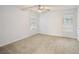 Neutral bedroom with carpet, ceiling fan, and bright windows at 3815 Glen Laurel Ct, Cumming, GA 30040