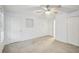 Bright bedroom with neutral carpet, ceiling fan, and ample closet space at 3815 Glen Laurel Ct, Cumming, GA 30040