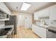 Bright kitchen featuring stainless steel appliances, granite countertops, white cabinets, subway tile and updated fixtures at 3815 Glen Laurel Ct, Cumming, GA 30040