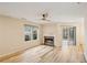 Bright living room with a fireplace and wood-look floors, creating a warm atmosphere at 3815 Glen Laurel Ct, Cumming, GA 30040