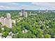Scenic aerial view of the neighborhood, showcasing the lush greenery and the city skyline in the background at 114 Terrace Ne Dr, Atlanta, GA 30305
