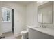 Powder room features quartz countertops, gray cabinets, and modern fixtures at 114 Terrace Ne Dr, Atlanta, GA 30305