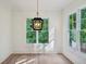 Dining room with large windows and a decorative light fixture at 114 Terrace Ne Dr, Atlanta, GA 30305