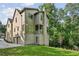 Beautiful home exterior with a combination of stone and siding with manicured lawn at 114 Terrace Ne Dr, Atlanta, GA 30305