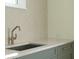 Modern kitchen with granite countertops, stainless steel sink, and light backsplash at 114 Terrace Ne Dr, Atlanta, GA 30305