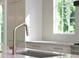 Kitchen sink with stainless faucet and a large window providing natural light at 114 Terrace Ne Dr, Atlanta, GA 30305