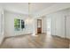 Sunlit living room with hardwood floors and a transom window at 114 Terrace Ne Dr, Atlanta, GA 30305