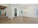 Open living area with hardwood floors, elegant lighting, and easy access to butler's pantry at 114 Terrace Ne Dr, Atlanta, GA 30305