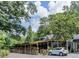 Charming restaurant exterior with covered patio and lush green surroundings perfect for relaxing outdoor dining at 114 Terrace Ne Dr, Atlanta, GA 30305