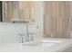 Close-up of modern chrome faucet and sink with bright countertop at 114 Terrace Ne Dr, Atlanta, GA 30305