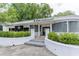 Exterior view of a white commercial building with a 