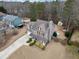 Inviting home with a lush front yard, complementing the tranquil setting, complete with a shed at 128 Holly Pl, Canton, GA 30115