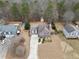 Charming home with well-manicured lawn and long driveway, nestled in a tranquil neighborhood at 128 Holly Pl, Canton, GA 30115