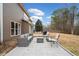 Outdoor patio with comfortable seating, a grill, and backyard views, ideal for entertaining and relaxation at 128 Holly Pl, Canton, GA 30115