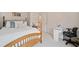 Cozy bedroom with hardwood flooring, a large bed, and a side table at 128 Holly Pl, Canton, GA 30115