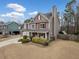 Beautiful two-story home boasts a spacious front yard, attached garage, and a classic design that complements the neighborhood at 128 Holly Pl, Canton, GA 30115