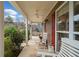Inviting front porch with comfortable seating, perfect for relaxing and enjoying the peaceful outdoor ambiance at 128 Holly Pl, Canton, GA 30115