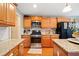 Well-equipped kitchen with stainless steel appliances, gas range, and granite countertops at 128 Holly Pl, Canton, GA 30115