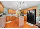 Charming kitchen with granite countertops, stainless steel appliances, and central island at 128 Holly Pl, Canton, GA 30115