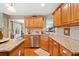 Kitchen featuring granite countertops, wood cabinets, stainless dishwasher, and island at 128 Holly Pl, Canton, GA 30115