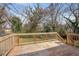 Spacious wooden back deck with a railing, perfect for outdoor relaxation and entertaining at 17 Turman #4 Se Ave, Atlanta, GA 30315