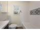 This bathroom features a white tile shower with mosaic tile accents, a modern vanity, and a window for natural light at 17 Turman #4 Se Ave, Atlanta, GA 30315
