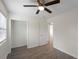 The bright bedroom features wood-look flooring, a closet, neutral paint, and modern lighting making it feel spacious at 17 Turman #4 Se Ave, Atlanta, GA 30315