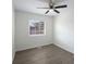 Cozy bedroom featuring wood-look flooring, neutral paint, updated lighting and lots of natural light from the window at 17 Turman #4 Se Ave, Atlanta, GA 30315