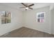 This bedroom features wood-look flooring, neutral walls and modern lighting with lots of natural light from two windows at 17 Turman #4 Se Ave, Atlanta, GA 30315