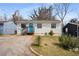 Well-maintained one-story home with blue door, green yard, and mature trees at 17 Turman #4 Se Ave, Atlanta, GA 30315