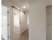 Hallway with sliding barn door, and view to adjacent room creates open flow and bright interior at 17 Turman #4 Se Ave, Atlanta, GA 30315