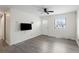 Cozy living room with wood floors, a TV, and a window overlooking the yard at 17 Turman #4 Se Ave, Atlanta, GA 30315