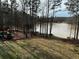 Expansive backyard features a playset and offers tranquil views of the lake at 25 Clay Ct, Hiram, GA 30141