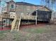Backyard featuring a multi-level deck, stairs, and screened porch area at 25 Clay Ct, Hiram, GA 30141