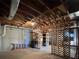 Unfinished basement features exposed ceiling and structural elements, with ladder and storage at 25 Clay Ct, Hiram, GA 30141